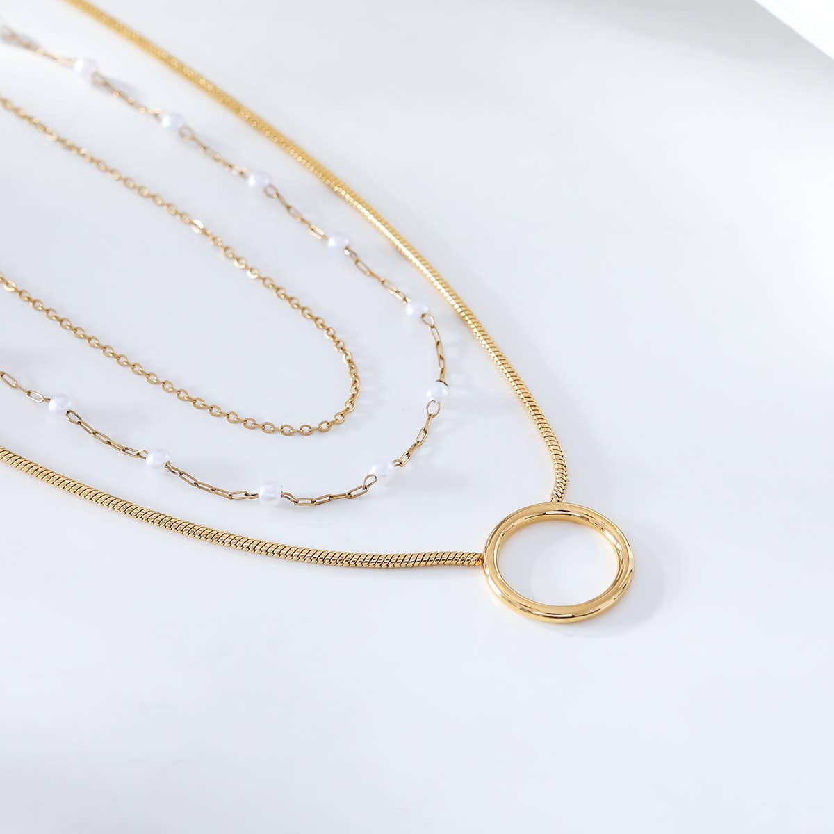 Dreifachkette mit Perlen und runder Kette